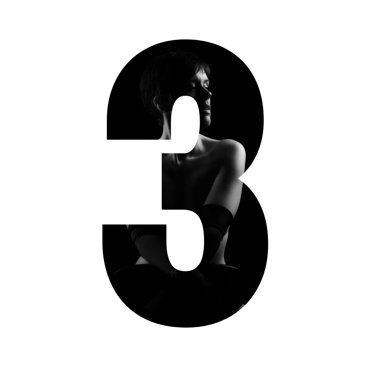 A bridal boudoir photograph cut into the shape of the number three